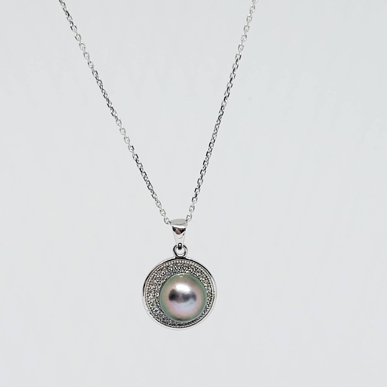 Collier en argent 925 avec perle de Tahiti bleue et aura rosée